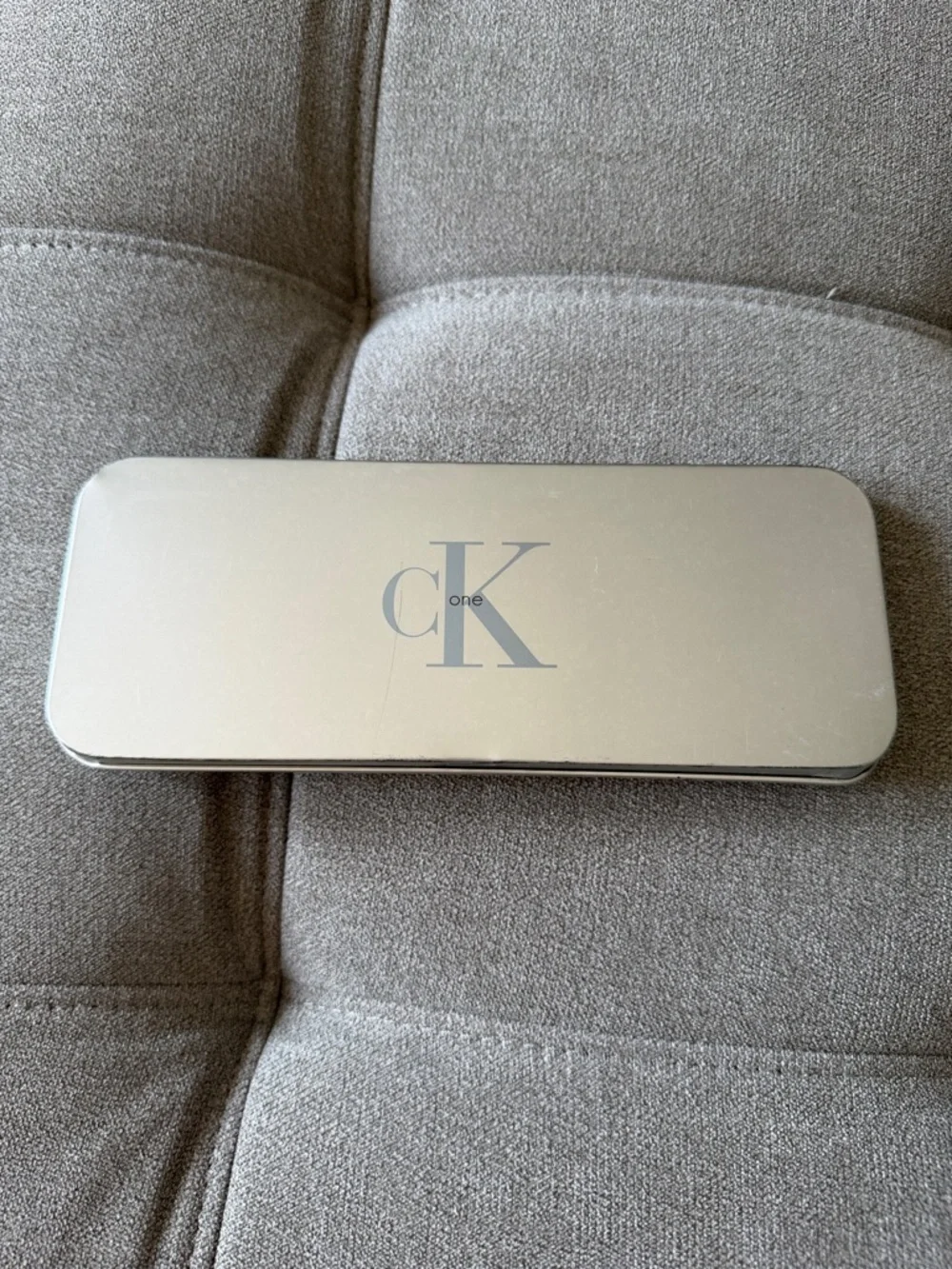 Calvin Klein silver CK One rectangular tin